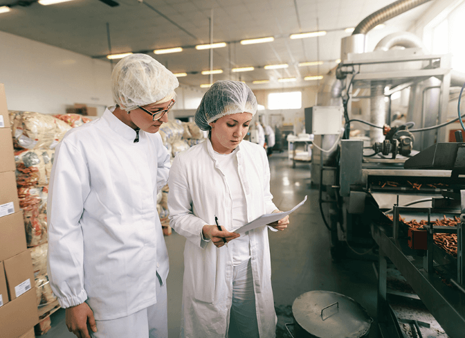 Case Studies Image One - Two people working in a factory